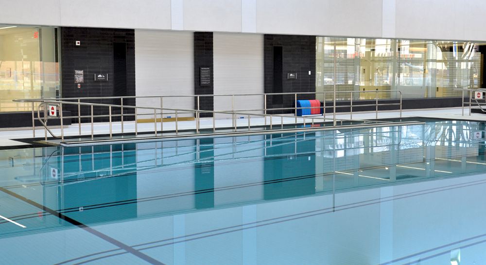 Indoor lap pool with ramp entry at the Regent Park Aquatic Centre